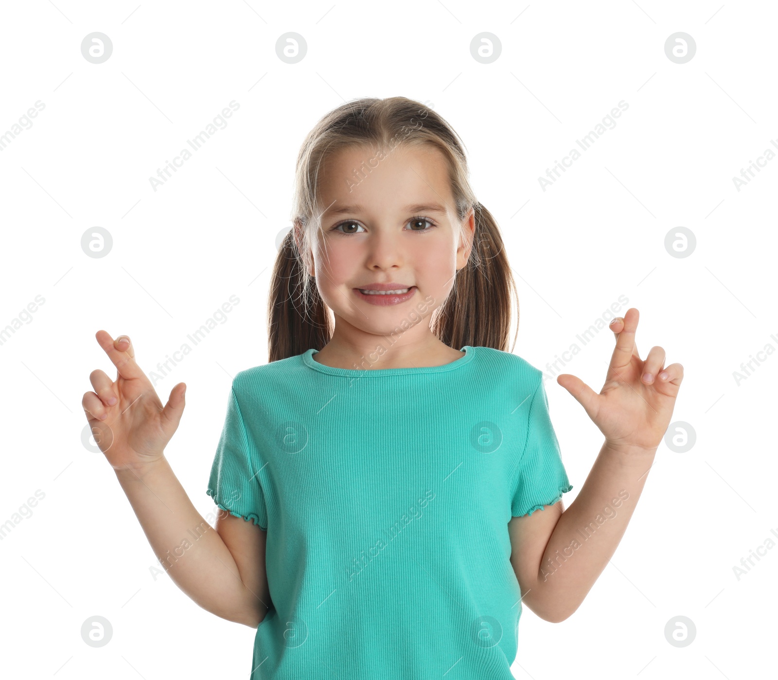 Photo of Child with crossed fingers on white background. Superstition concept