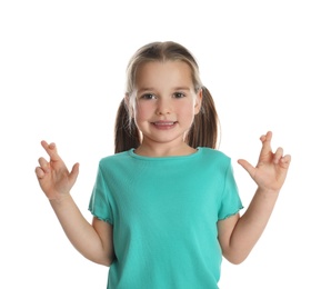 Photo of Child with crossed fingers on white background. Superstition concept