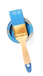 Photo of Can of blue paint with brush on white background, top view