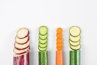 Photo of Rainbow composition with fresh vegetables on white background, flat lay