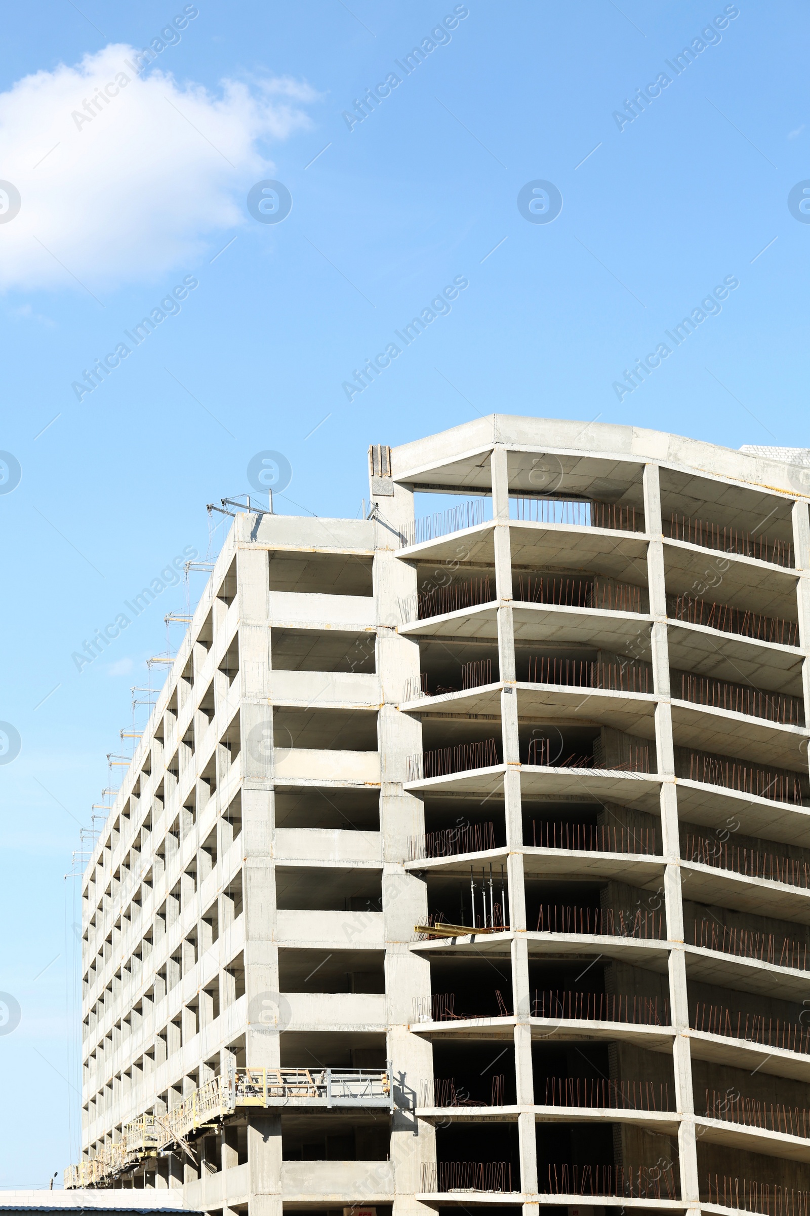 Photo of Construction site with unfinished building on sunny day