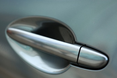 Closeup view of car door with handle