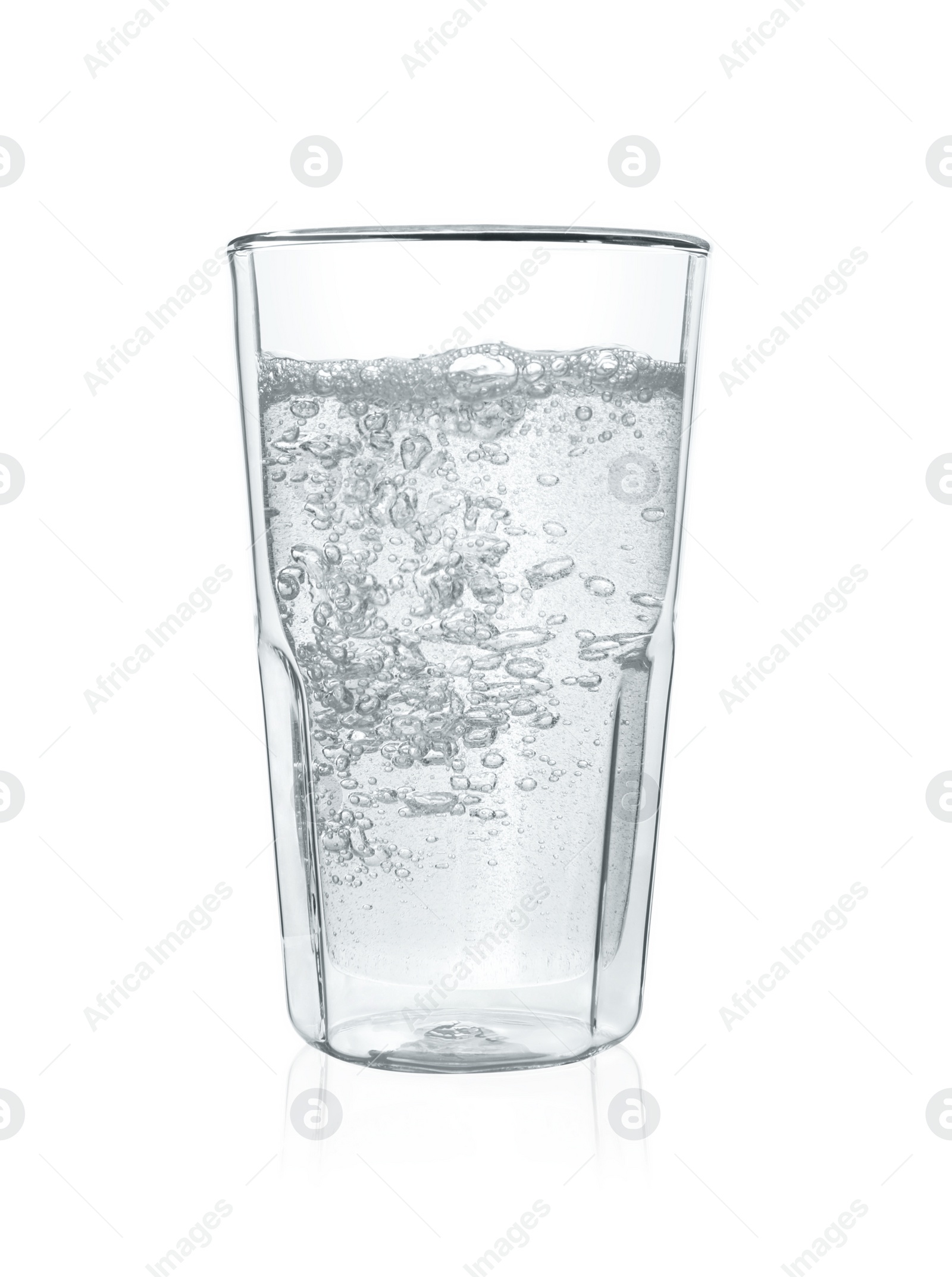 Photo of Pouring soda water into glass on white background