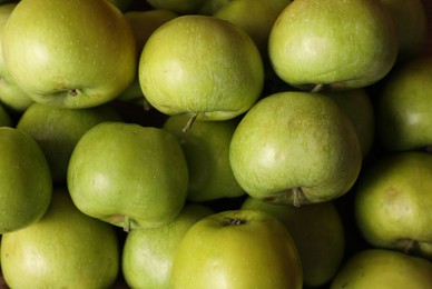 Photo of Fresh ripe green apples as background, top view