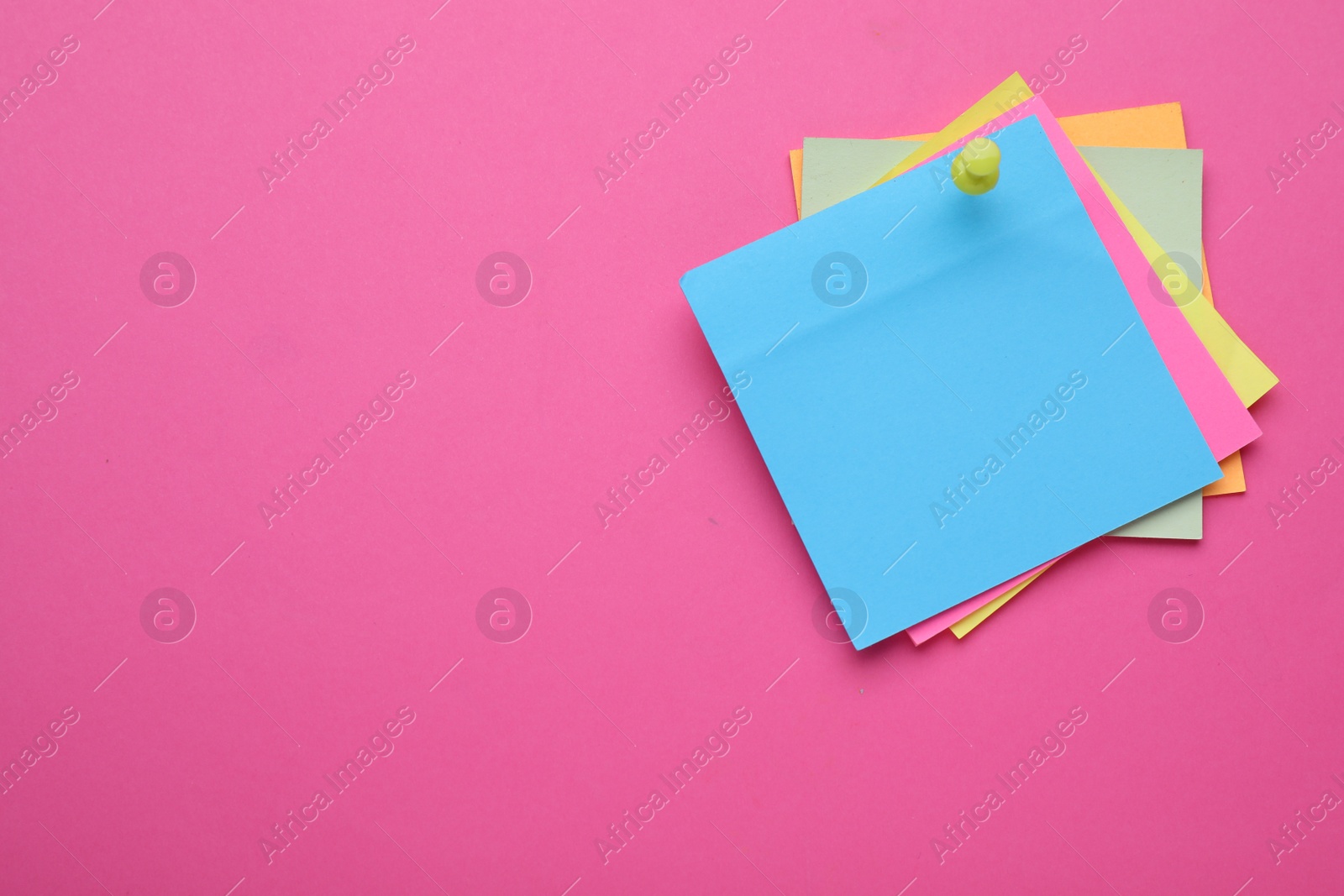 Photo of Colorful empty notes pinned on pink background, space for text