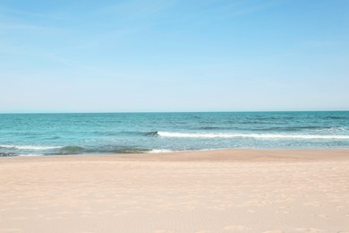 Photo of Picturesque view of beautiful sea and sandy beach on sunny day