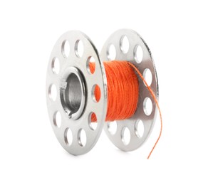Photo of Metal spool of orange sewing thread isolated on white
