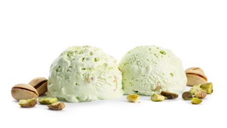 Photo of Scoops of delicious pistachio ice cream and nuts isolated on white