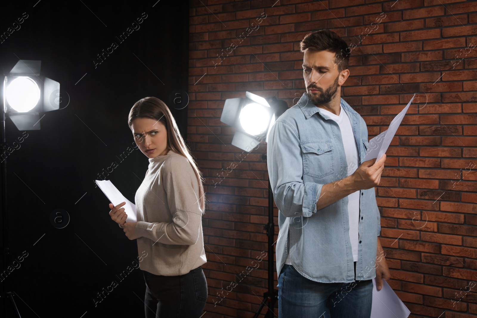 Photo of Professional actors rehearsing on stage in theatre