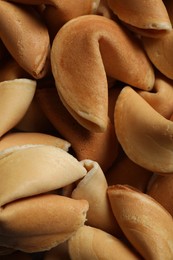 Photo of Pile of traditional fortune cookies as background, closeup