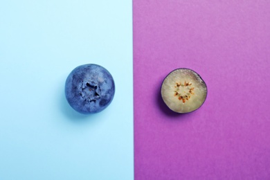 Flat lay composition with tasty blueberry on color background