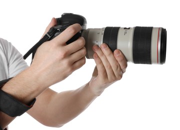 Photographer holding modern camera on white background, closeup