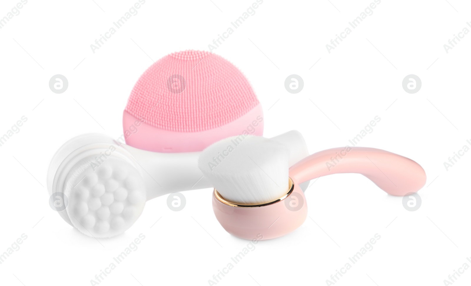 Photo of Face cleansing brushes isolated on white. Cosmetic tools