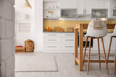 Modern kitchen interior with stylish wooden table