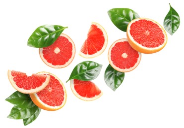 Image of Tasty ripe grapefruits and green leaves falling on white background