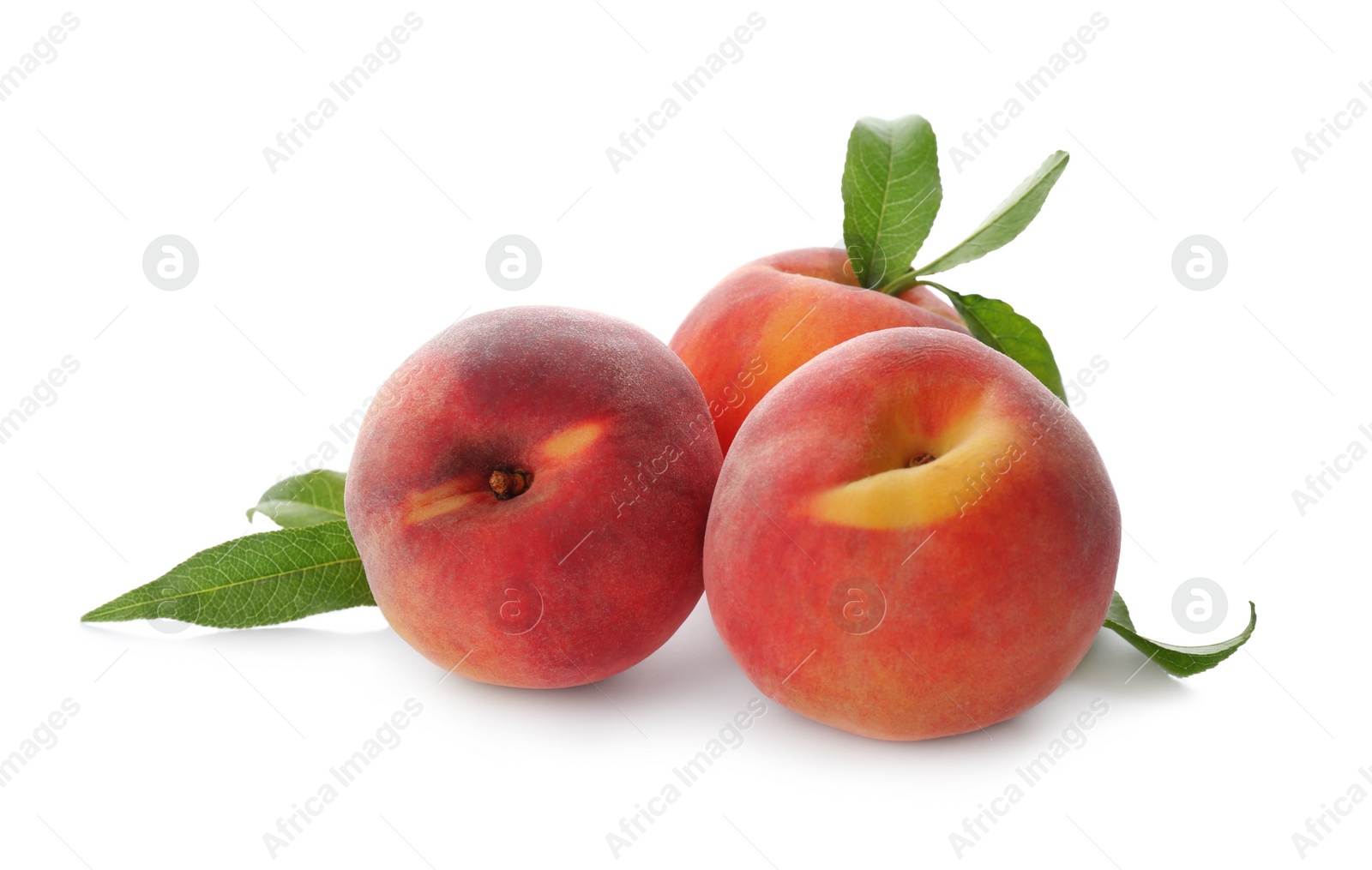 Photo of Delicious ripe juicy peaches with leaves isolated on white