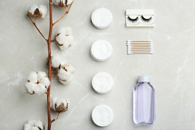 Flat lay composition with cotton pads on grey background