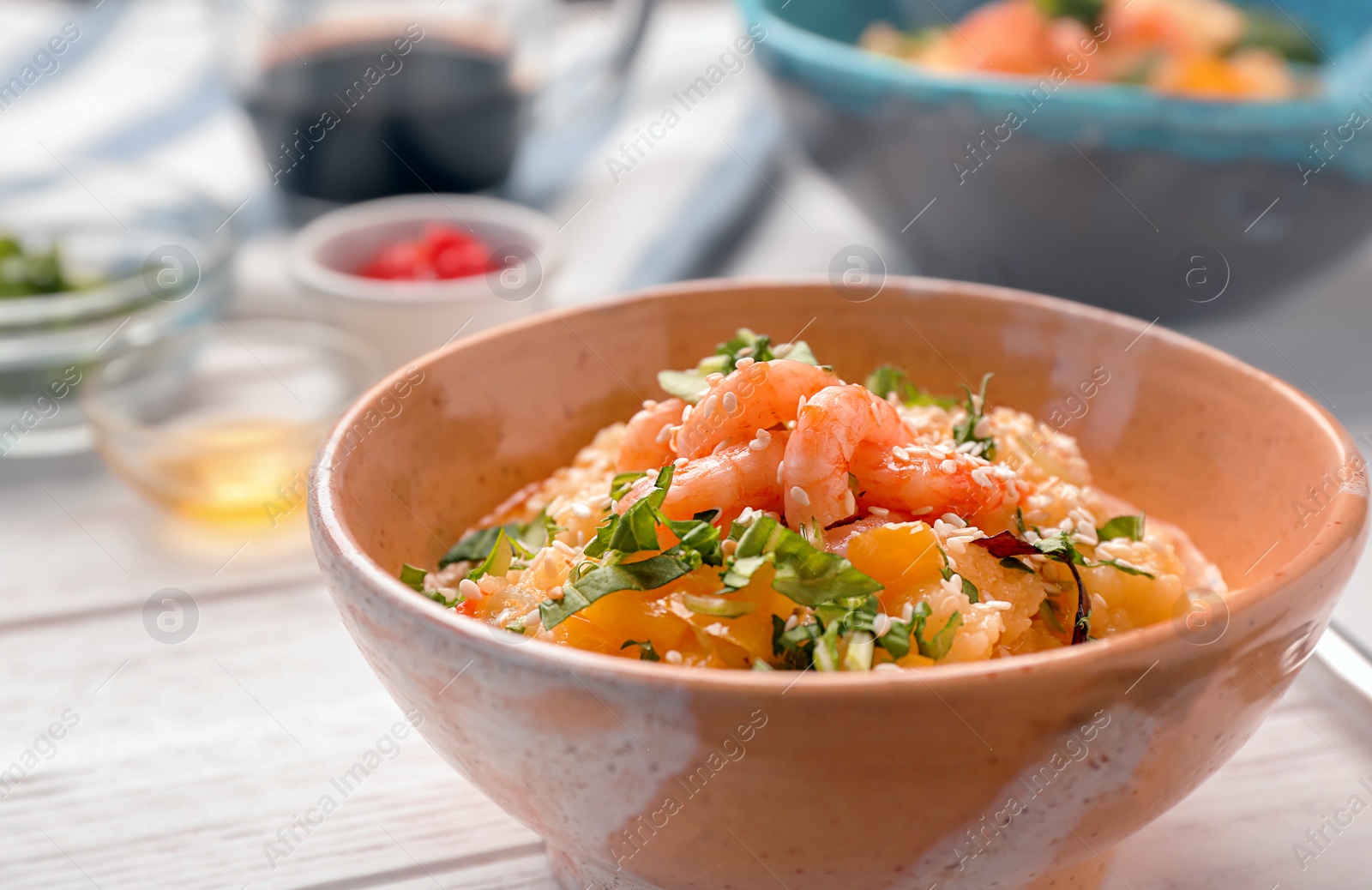 Photo of Bowl with tasty shrimps and grits, closeup