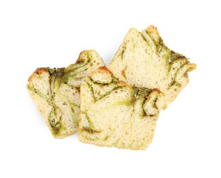 Photo of Slices of freshly baked pesto bread isolated on white, top view