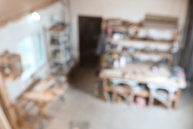 Blurred view of carpentry shop interior. Working space