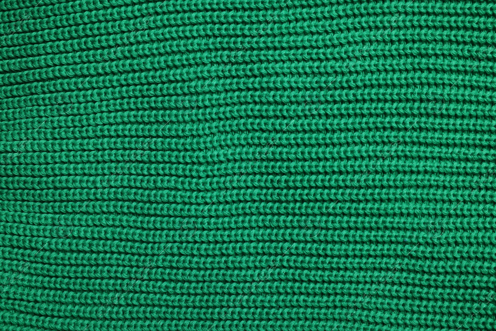 Photo of Texture of soft green fabric as background, top view