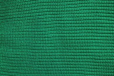 Photo of Texture of soft green fabric as background, top view