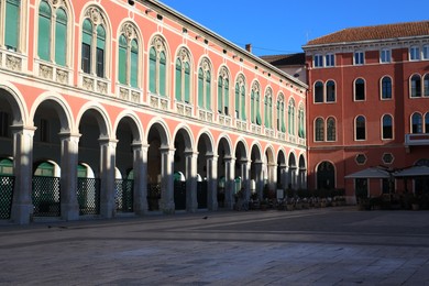 Beautiful view of city square with vintage building under blue sky