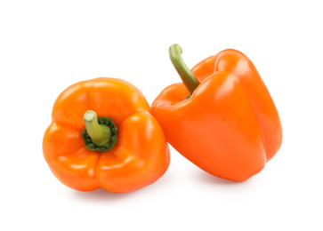 Photo of Ripe orange bell peppers isolated on white