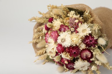 Photo of Beautiful bouquet of dry flowers on white background