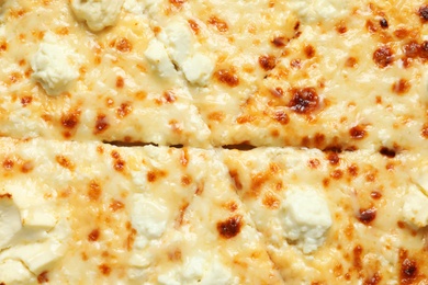 Photo of Delicious hot cheese pizza as background, closeup