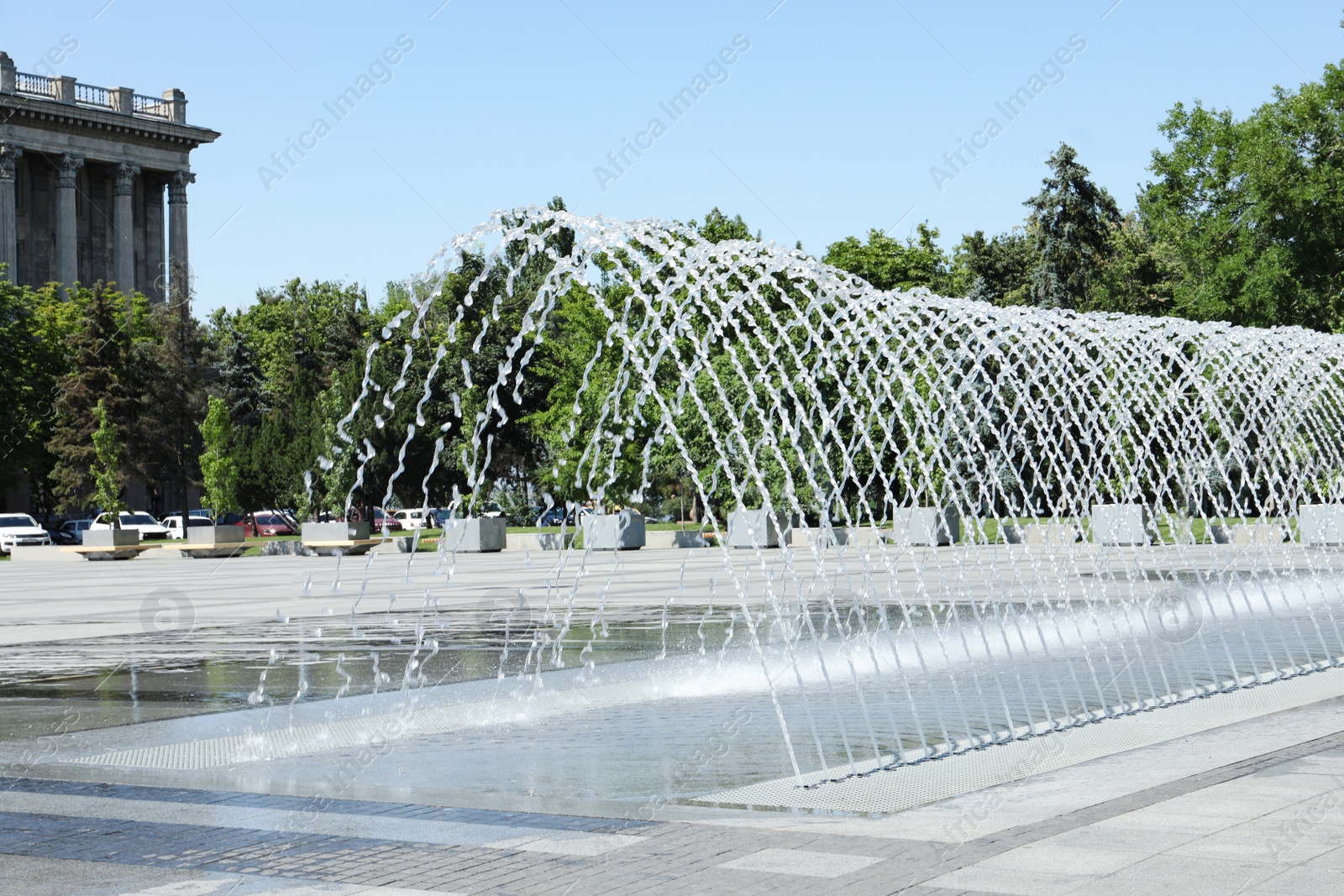 Photo of City square with beautiful fountains on sunny day