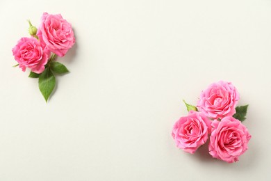 Photo of Happy Mother's Day. Beautiful roses on white background, flat lay. Space for text