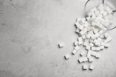 Refined sugar cubes on grey background