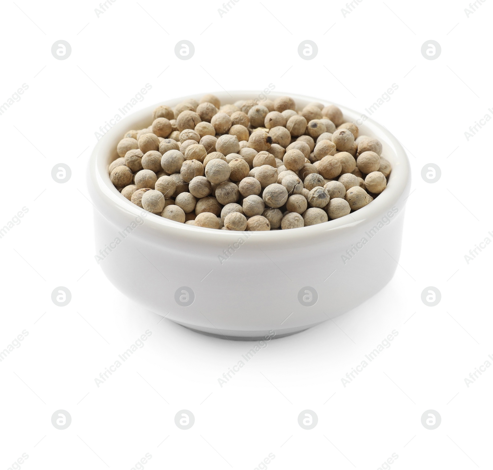 Photo of Aromatic spice. Many peppercorns in bowl isolated on white