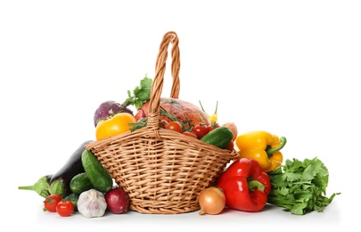 Many fresh ripe vegetables with basket on white background