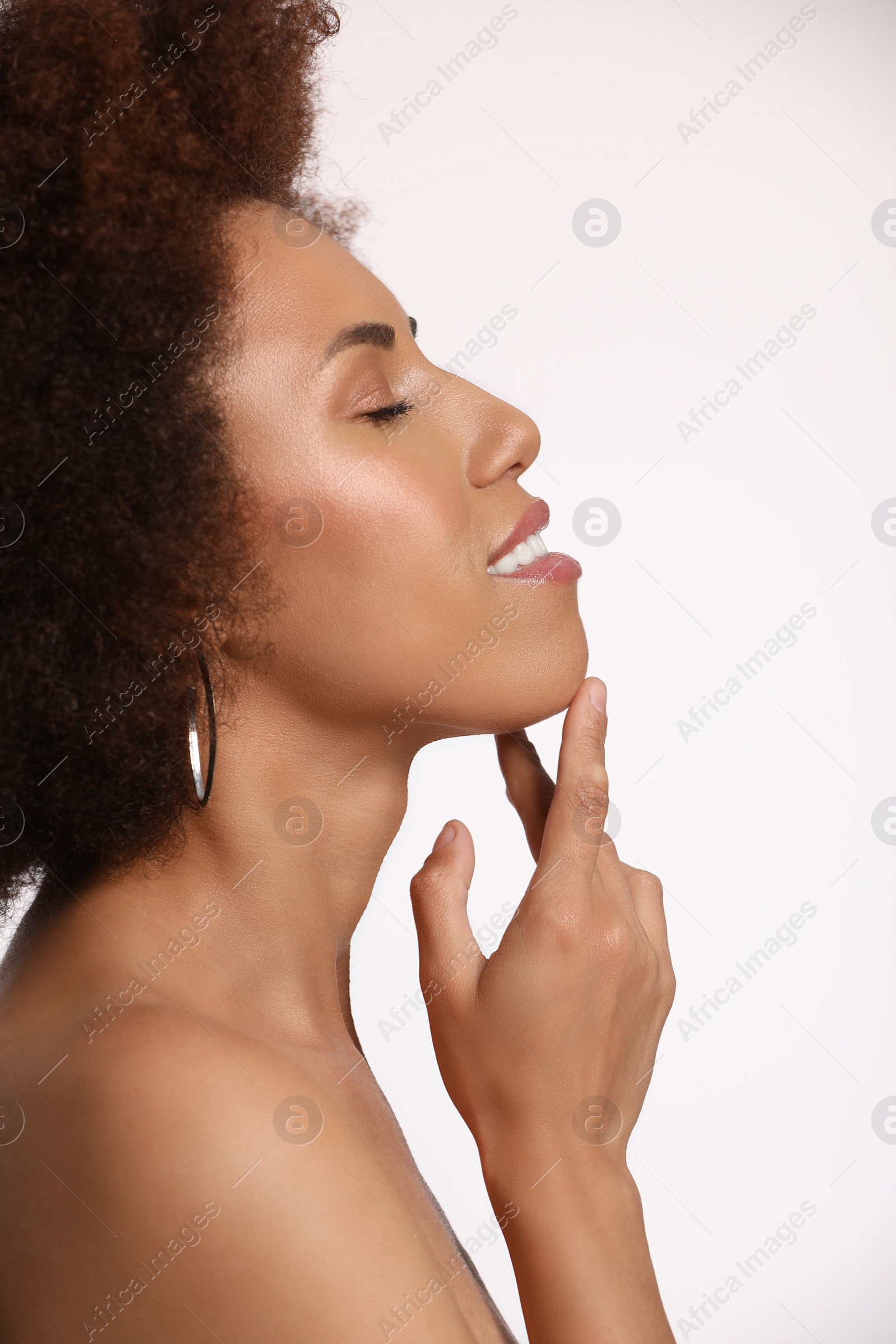 Photo of Portrait of beautiful young woman on white background