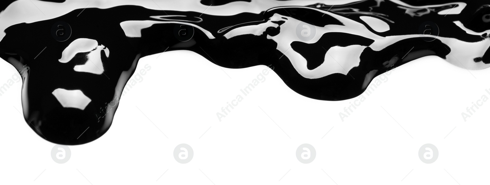 Photo of Blot of black glossy paint on white background