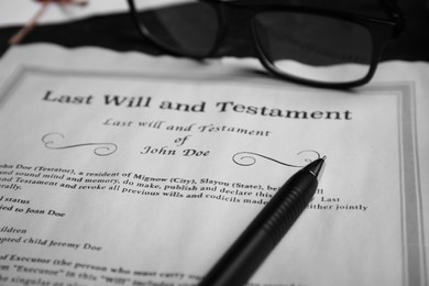 Last will and testament near pen, glasses on table, closeup