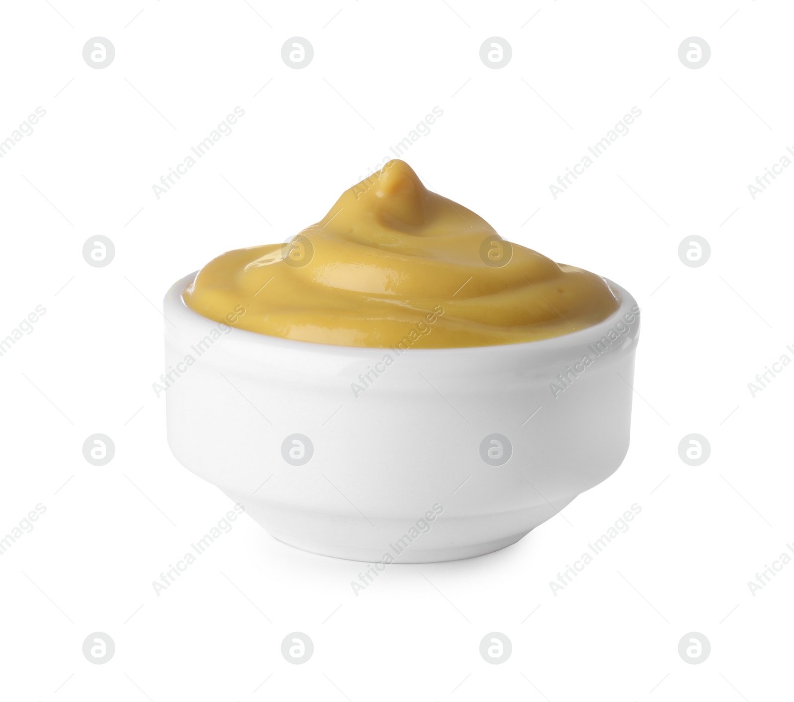 Photo of Bowl with delicious mustard isolated on white