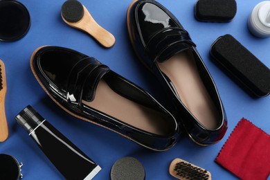 Shoe care accessories and footwear on blue background, above view