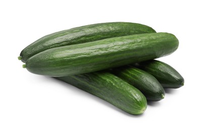 Photo of Many long fresh cucumbers isolated on white