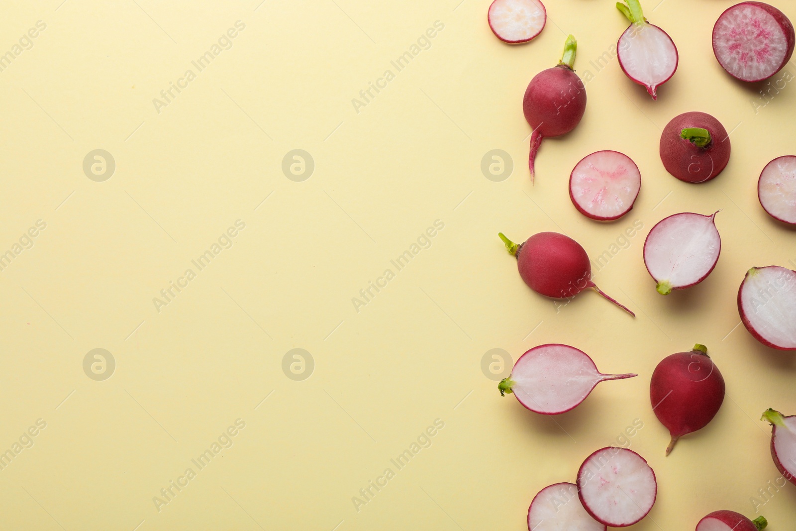 Photo of Fresh ripe radish on beige background, flat lay. Space for text