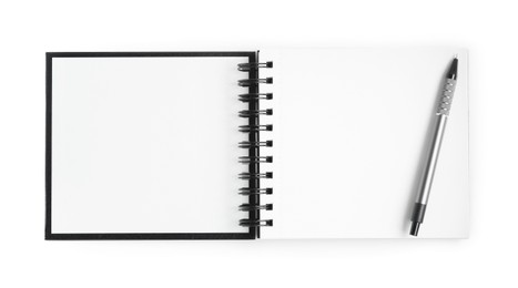 Photo of One notebook and pen isolated on white, top view