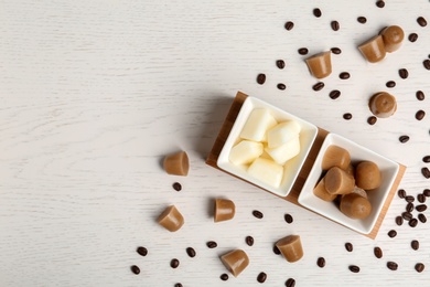 Photo of Flat lay composition with milk and coffee ice cubes on white wooden background. Space for text