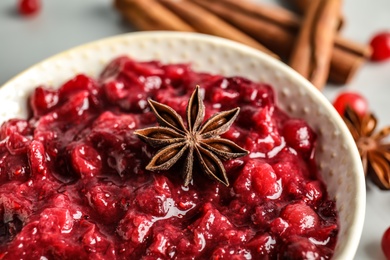 Plate of cranberry sauce with anise on table, closeup