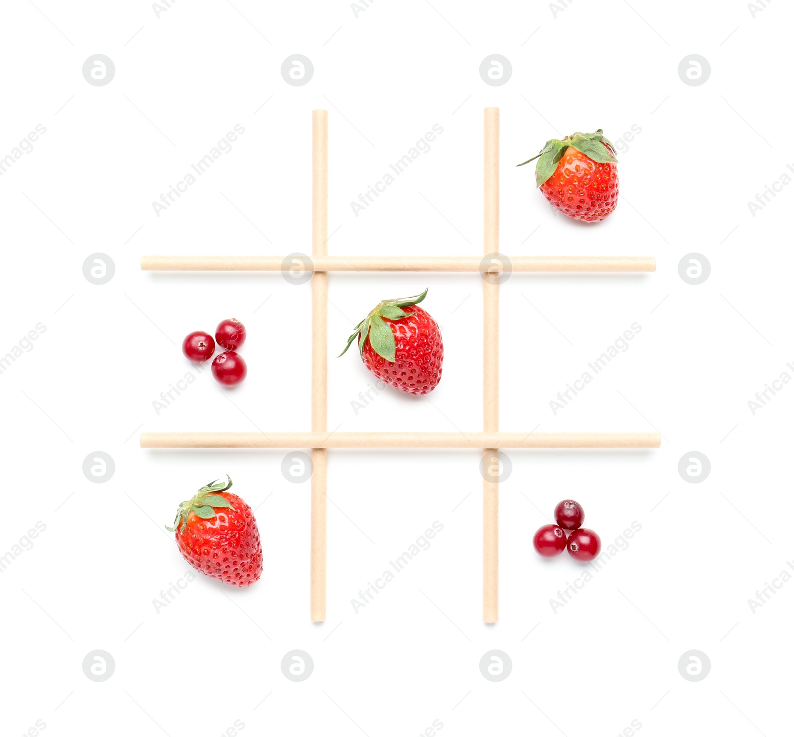 Photo of Tic tac toe game made with berries isolated on white, top view