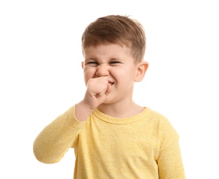 Cute boy suffering from cough on white background