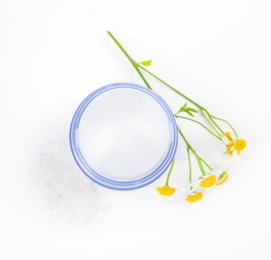 Photo of Natural crystal alum deodorant with chamomile flowers on white background, top view