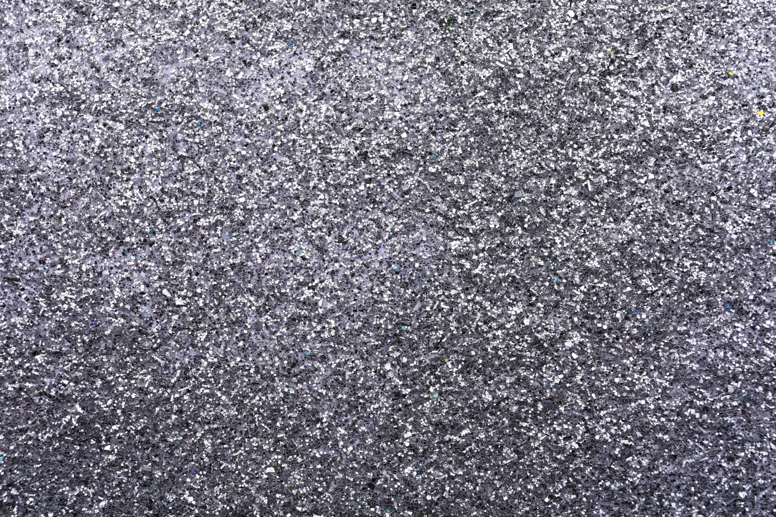 Photo of Beautiful shiny grey glitter as background, closeup