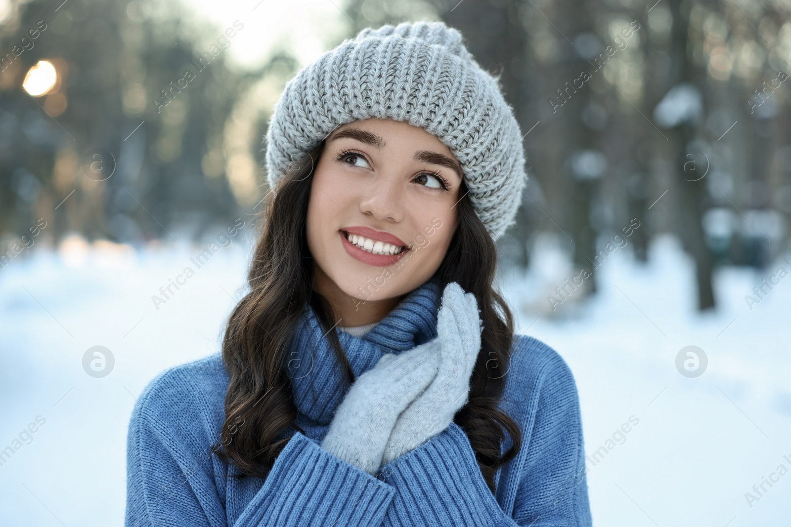 Photo of Portrait of smiling woman in snowy park